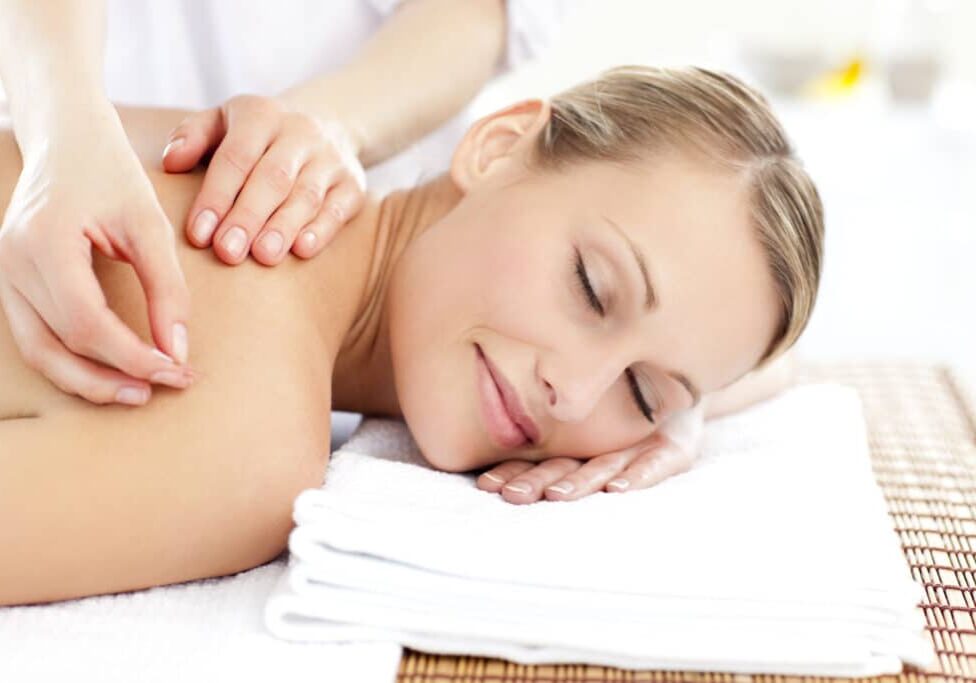 Radiant woman receiving an acupuncture treatment in a health spa